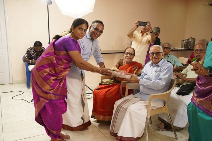 Elders receiving a tray of blessings