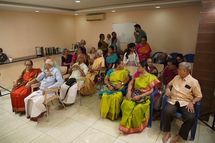 Relatives seated together watching the ceremony